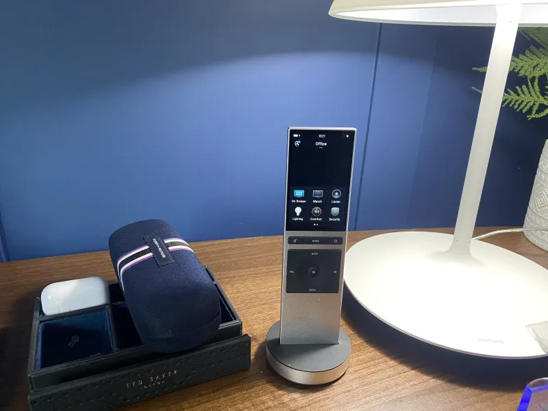 Smart-home touchscreen showing lighting, comfort, security, television and music controls