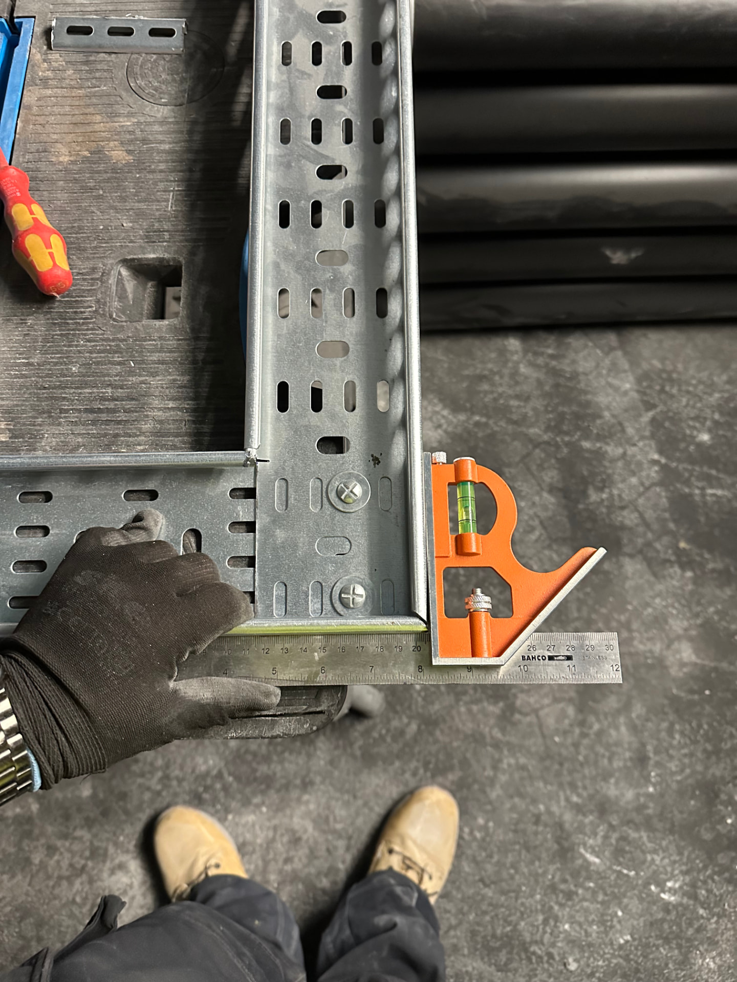 Cable tray bend checked square and level during installation quality control