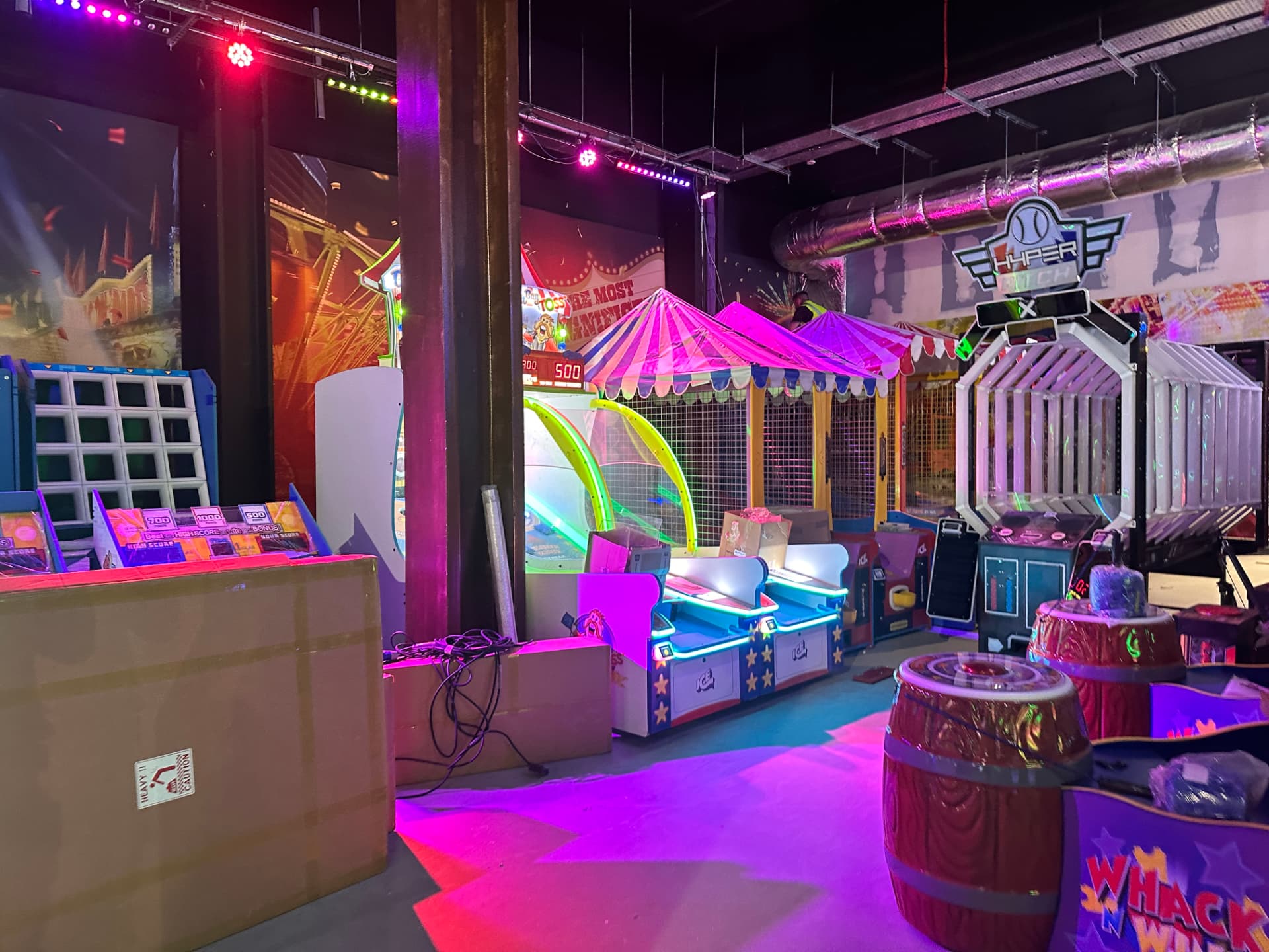 Fairground themed games zone with feature lighting and ticket machines