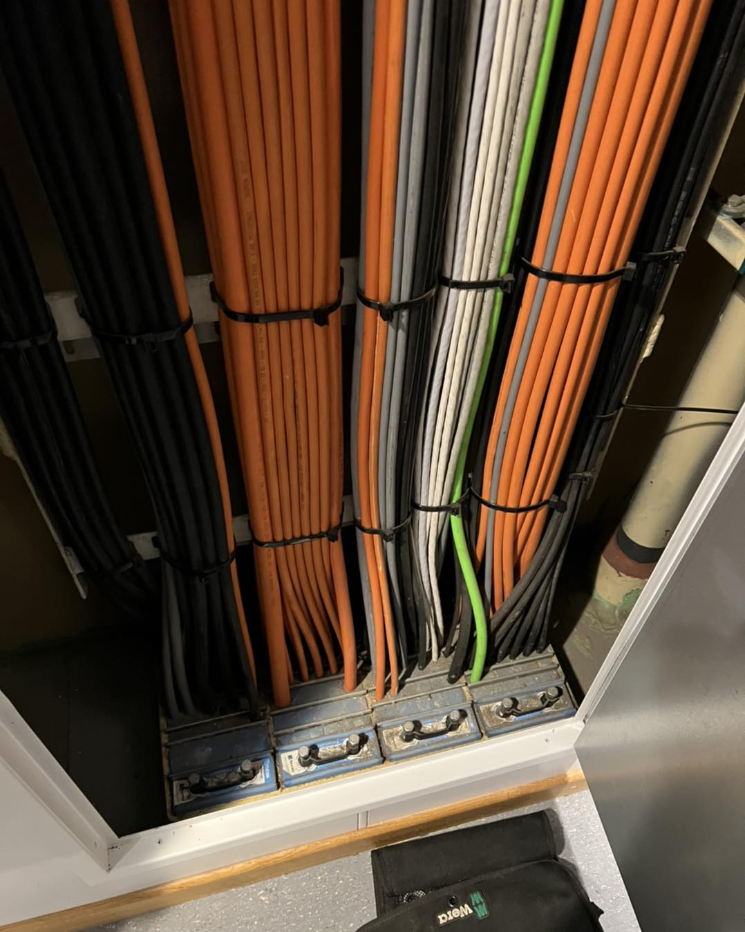 Precision dressed power cables secured through modular transit frame containment