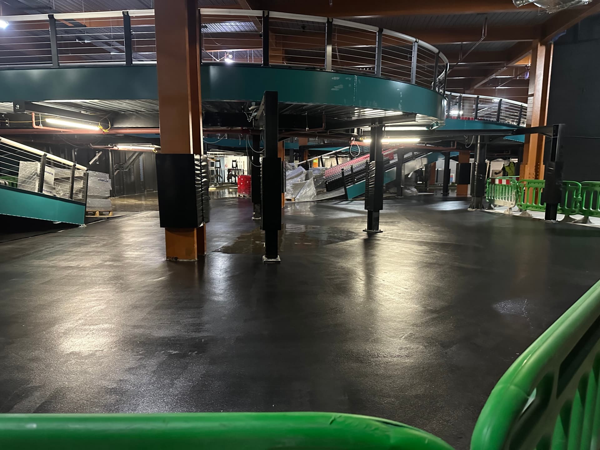 Structural support pillars alongside an indoor karting track under construction